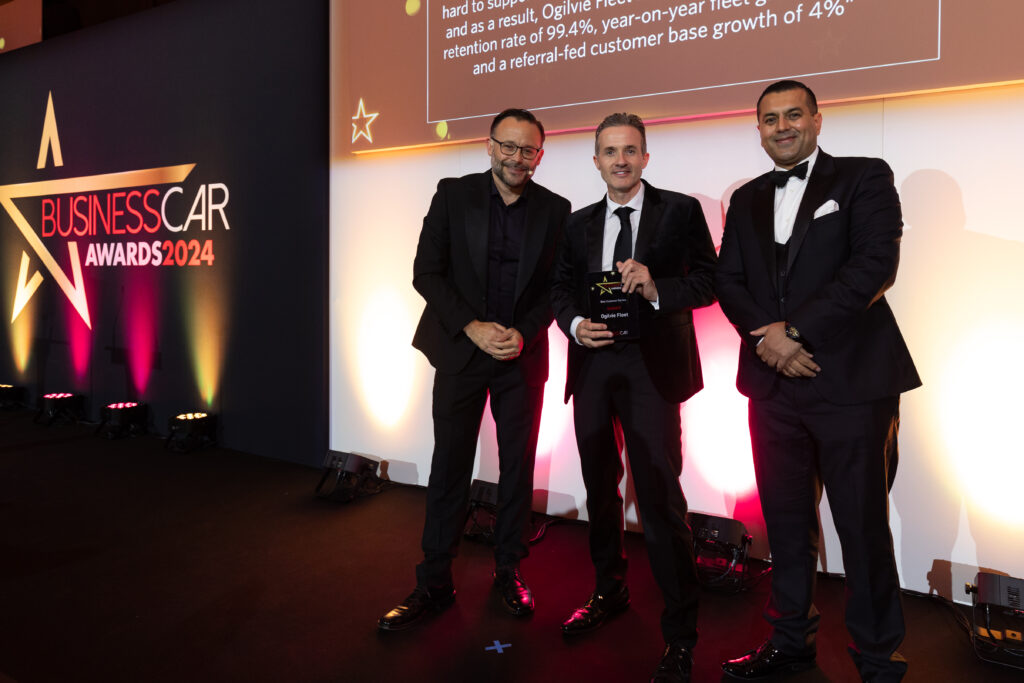 Nick Hardy is presented with the Best Customer Service trophy at the Business Car Awards